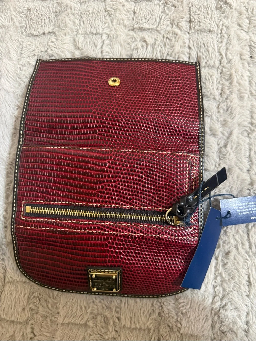 Dooney & Bourke Burgundy Textured Clutch Wallet with Gold Plaque